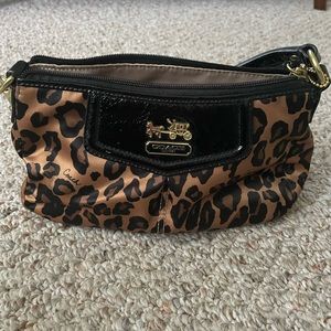 Coach mini bag - very small, 9x5x4, won’t fit much more than a phone and keys.